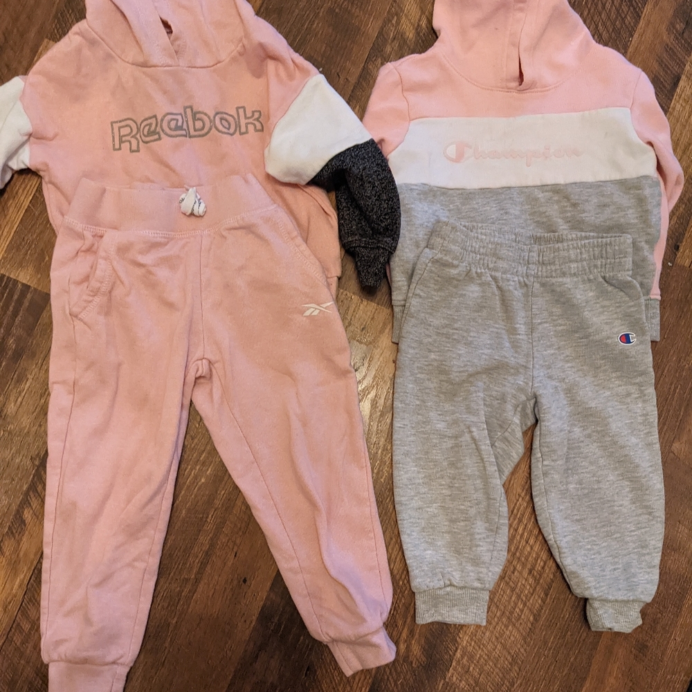 2 toddler girls sweat suits Reebok and Champion